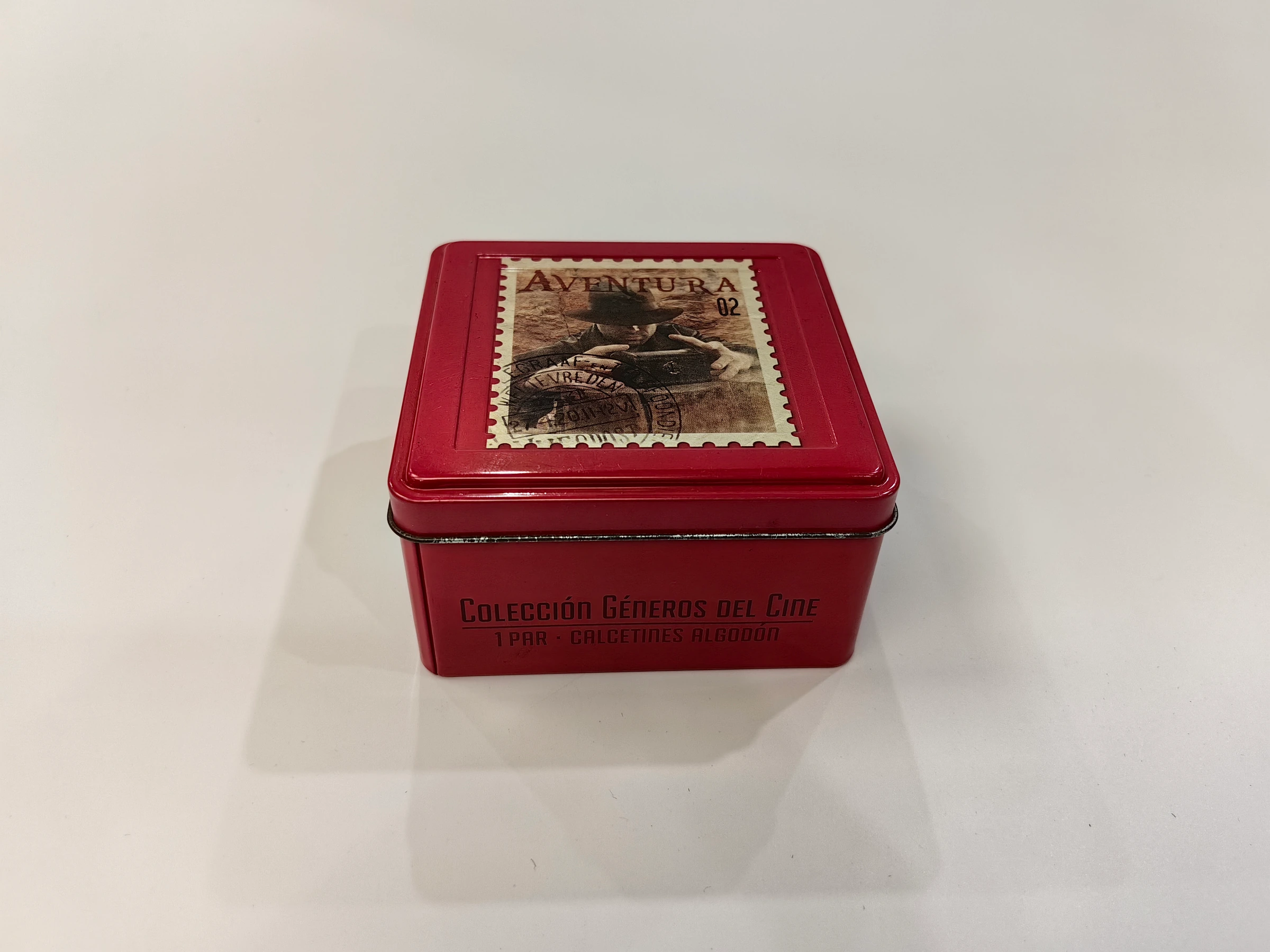 Small red square printed tin