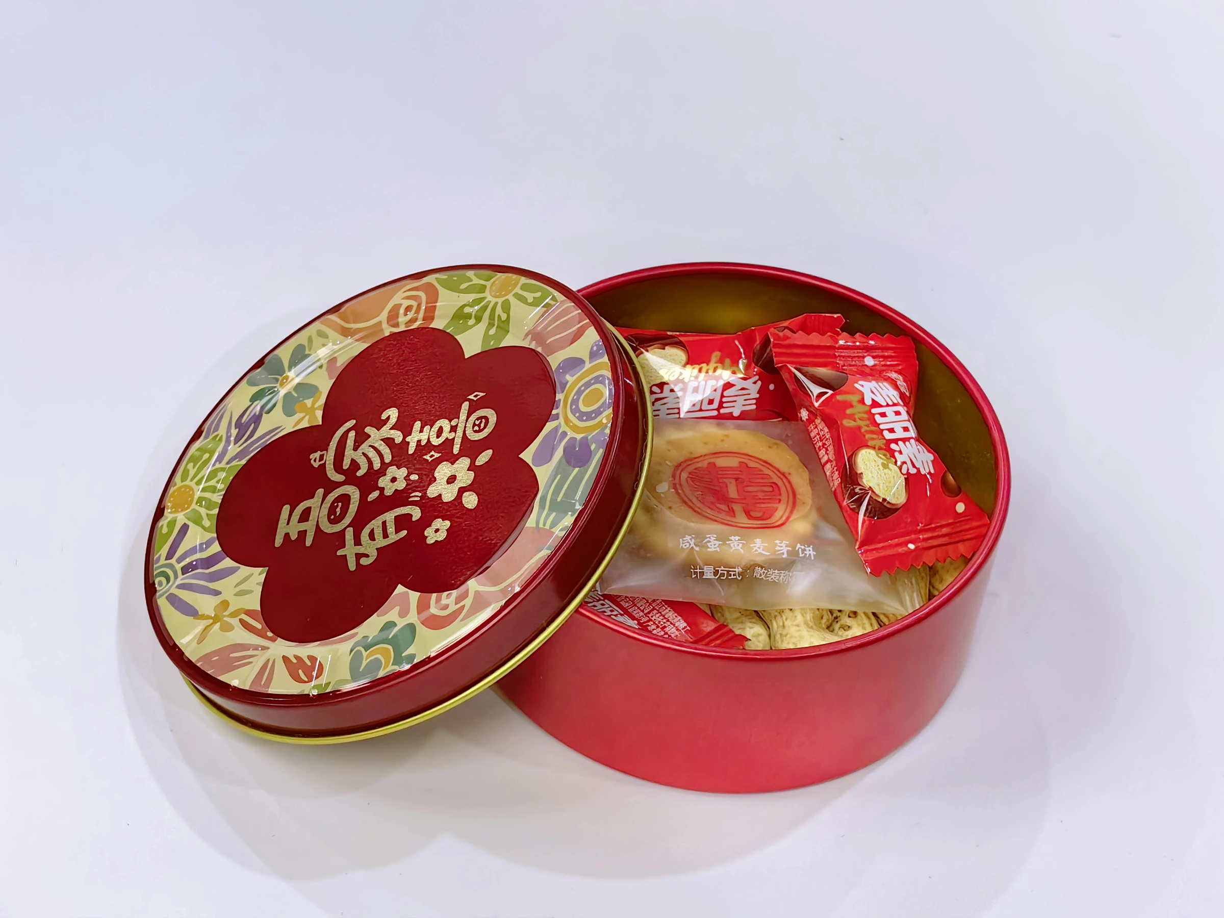 Open red round gift tin