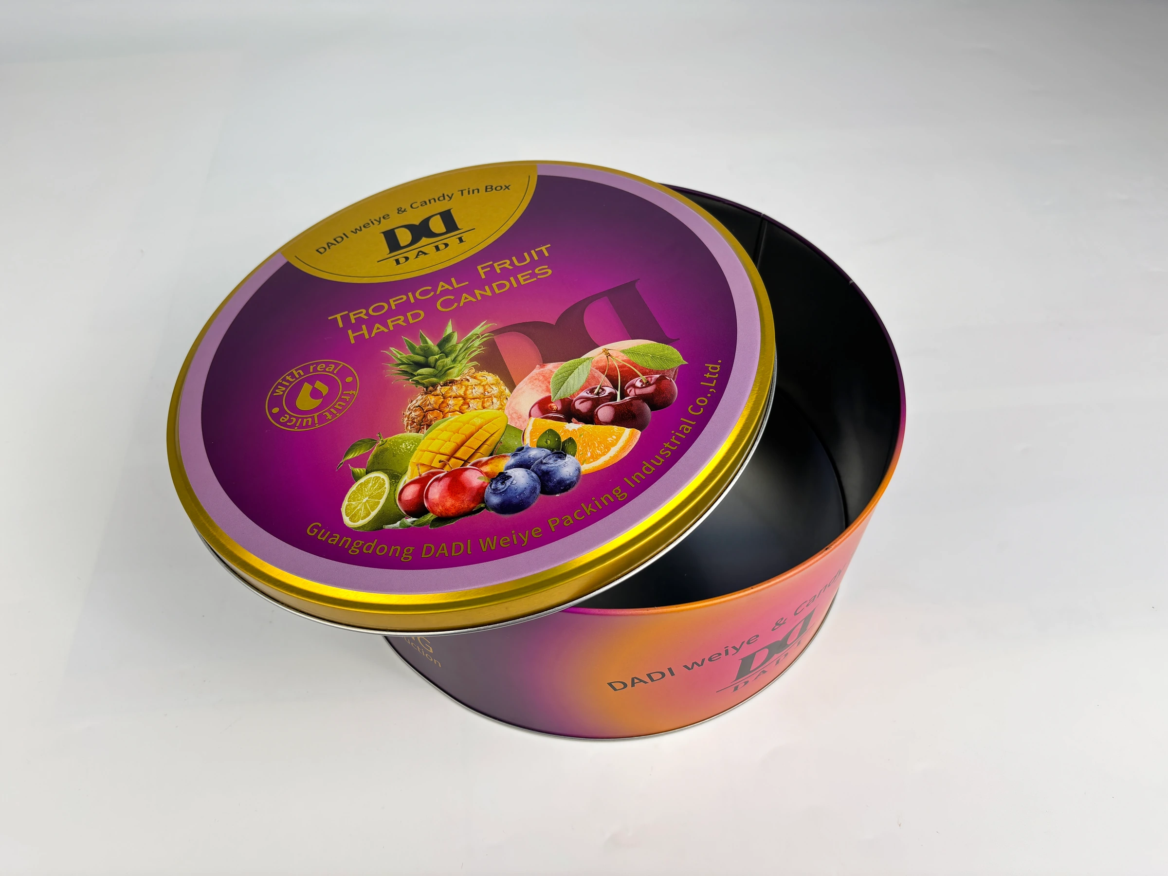 Open purple round food tin