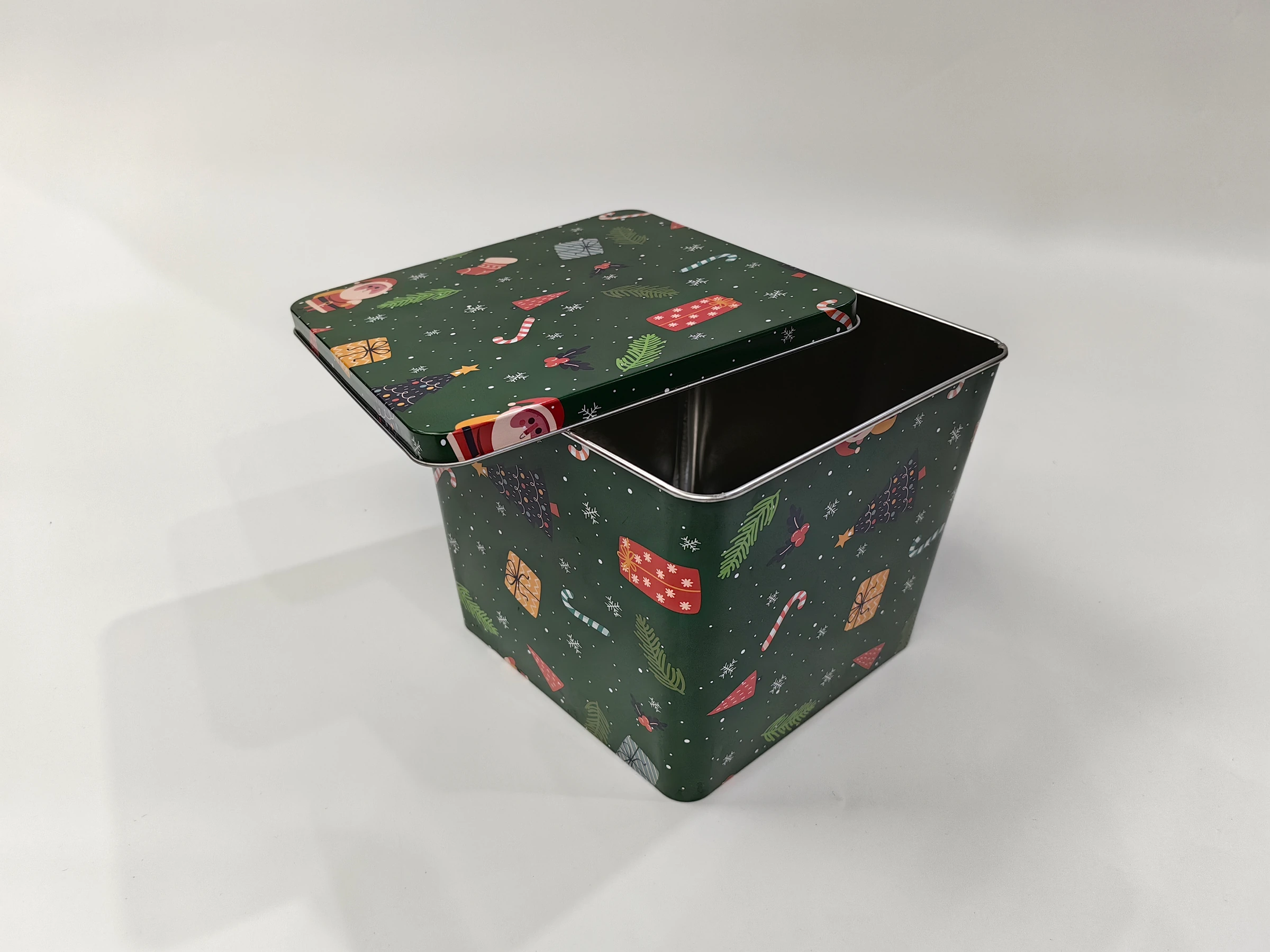 Green square seasonal tin shown open