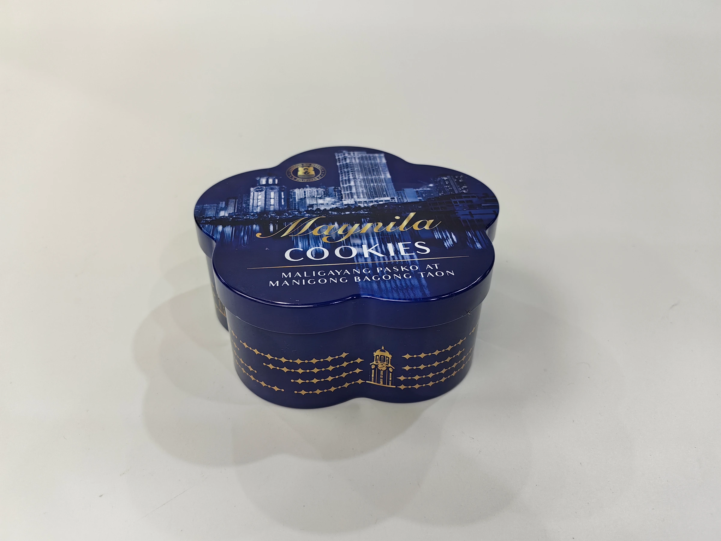 Blue flower-shaped printed tin