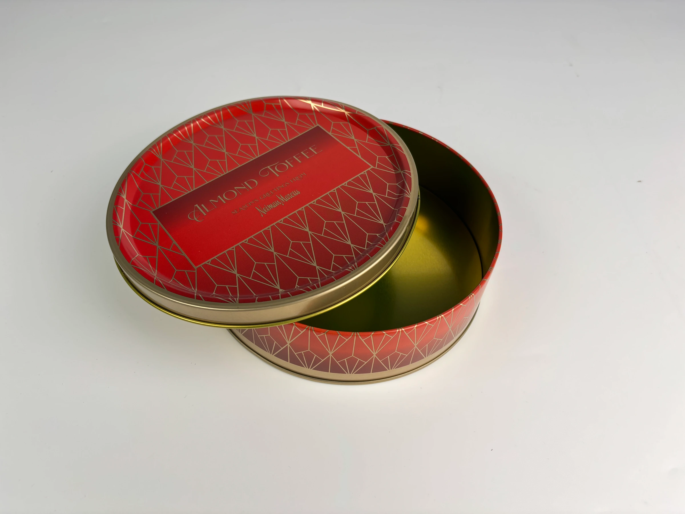 Open red decorative round gift tin
