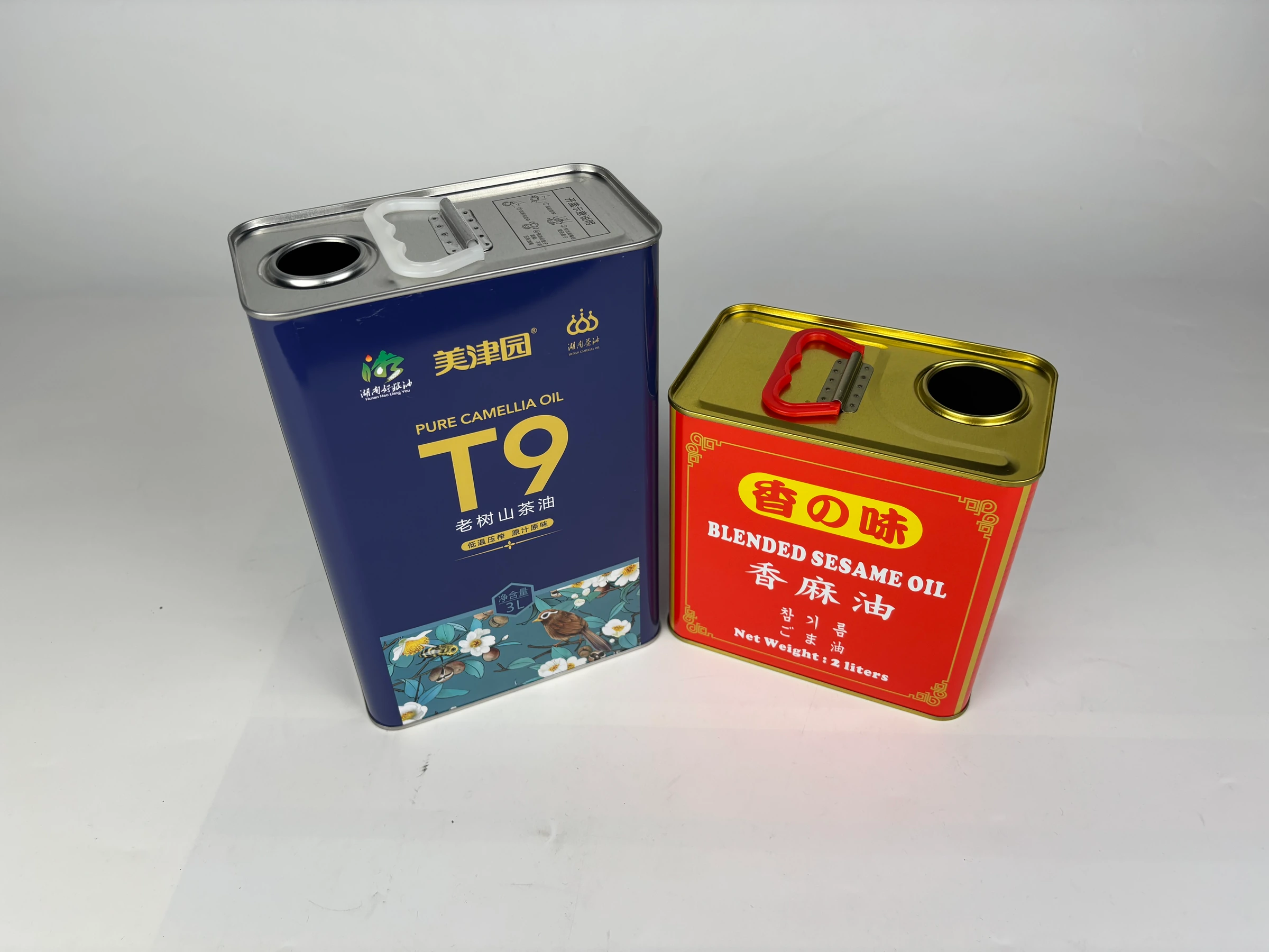 Two handled rectangular edible oil tins