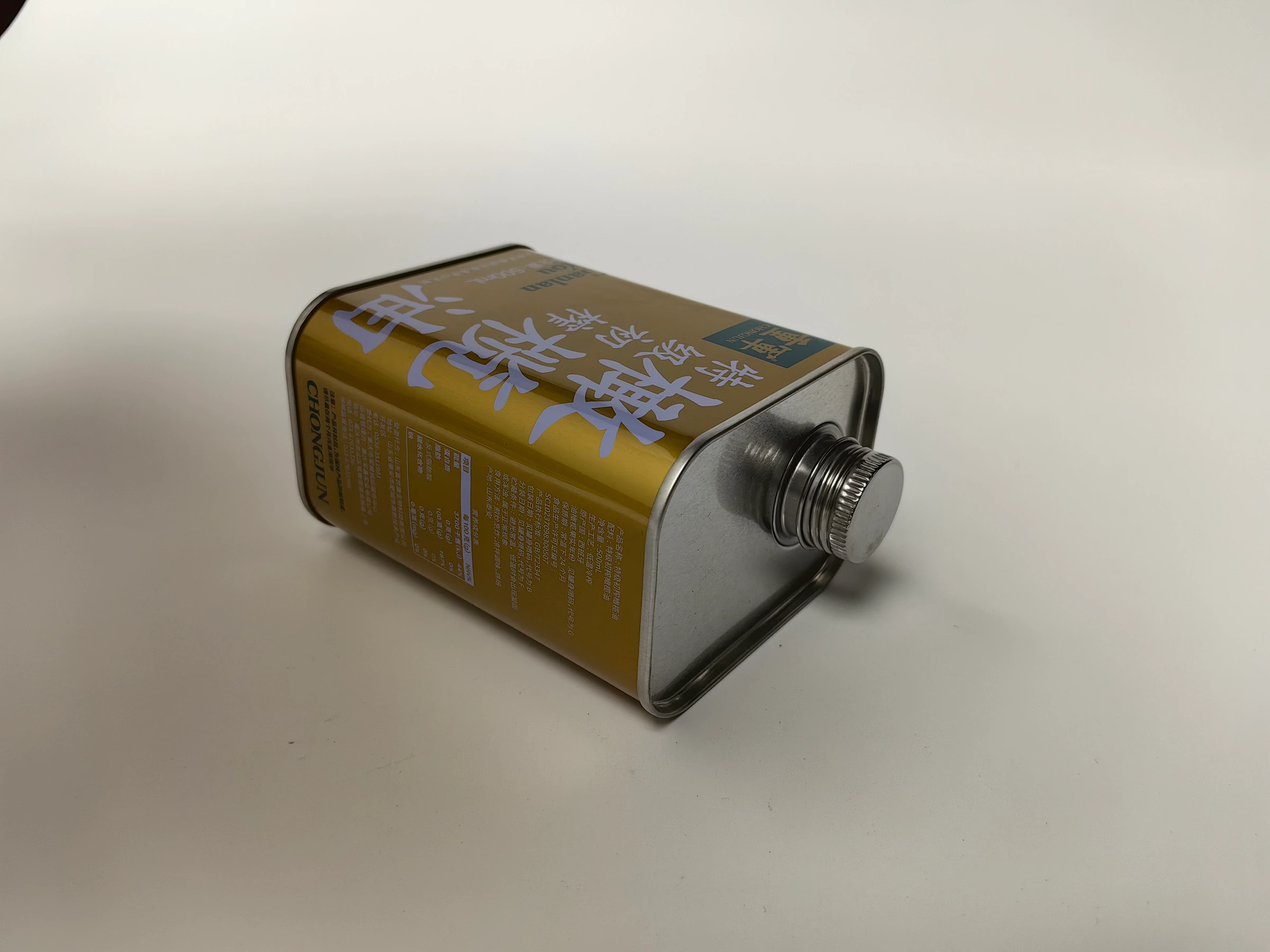 Edible oil tin laid down to show closure